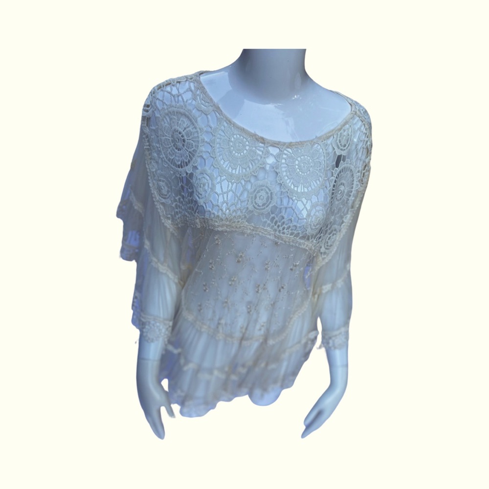 An original 1980’s Mimi lace poncho.  The color is off white. One size fits all.